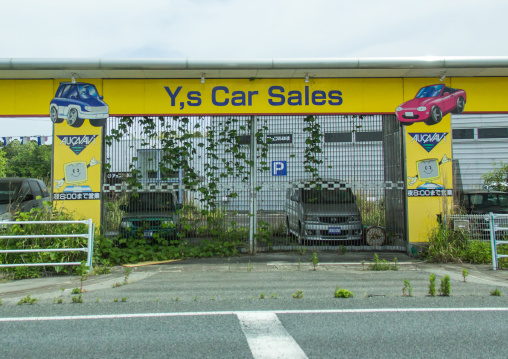 Abandoned car shop in the difficult-to-return zone after the daiichi nuclear power plant irradiation, Fukushima prefecture, Tomioka, Japan