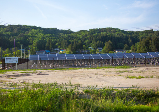 Solar panels in the highly contaminated area after the daiichi nuclear power plant irradiation, Fukushima prefecture, Iitate, Japan