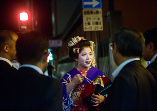 Geisha with businessmen in the streets of gion, Kansai region, Kyoto, Japan