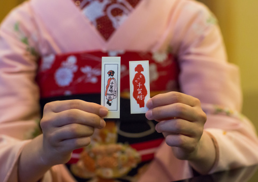 16 Years old maiko called chikasaya showing her business cards, Kansai region, Kyoto, Japan