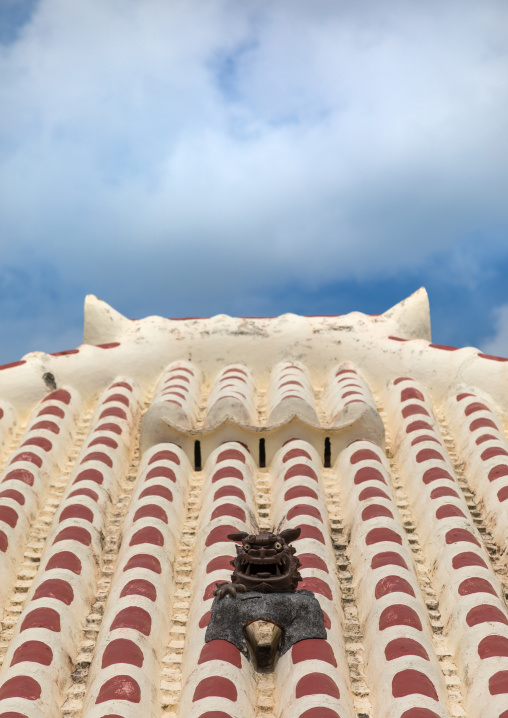 Shisa lion atop traditional tile roof to protect the house from the bad spirits, Yaeyama Islands, Taketomi island, Japan
