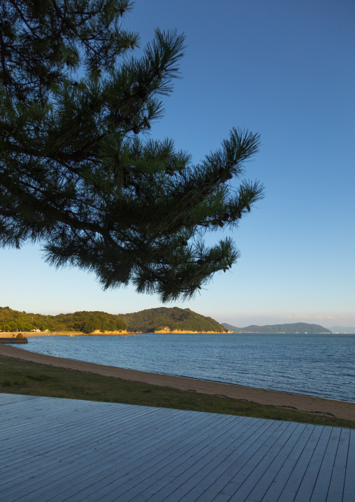 Wooden terrace beside tropical sea in Benesse house hotel, Seto Inland Sea, Naoshima, Japan