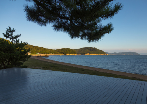 Wooden terrace beside tropical sea in Benesse house hotel, Seto Inland Sea, Naoshima, Japan