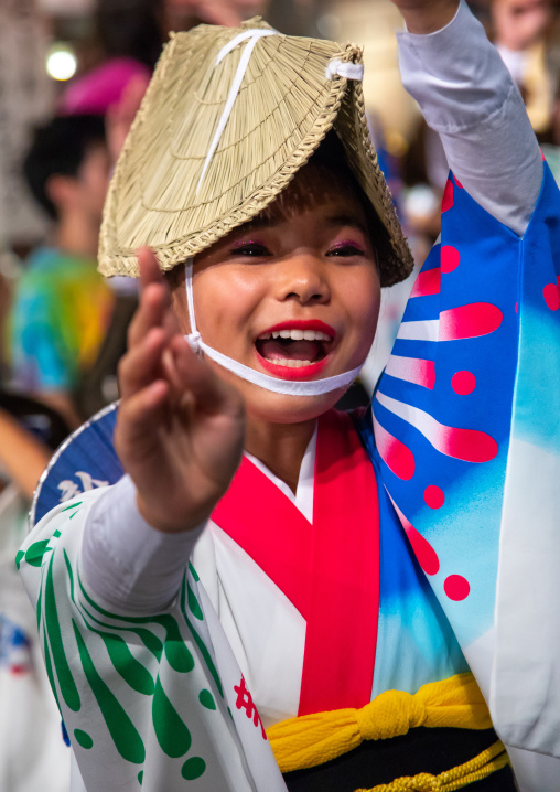Japanese girl with straw hat during the Koenji Awaodori dance summer street festival, Kanto region, Tokyo, Japan