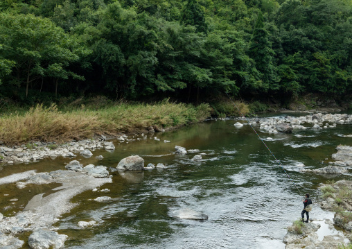 Japanese man fishing in a river, Kyoto Prefecture, Miyama, Japan