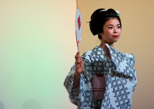 Maiko woman dancing on stage during a stage, Kansai region, Kyoto, Japan