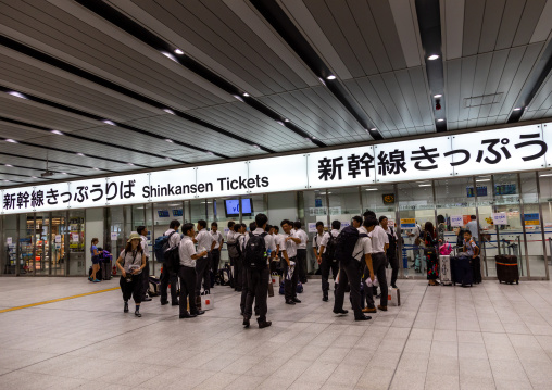Students in Shinkansen train station, Kansai region, Osaka, Japan