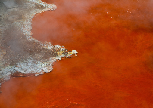 Orange thermal mud hell in Kamado jigoku cooking pot hell, Oita Prefecture, Beppu, Japan