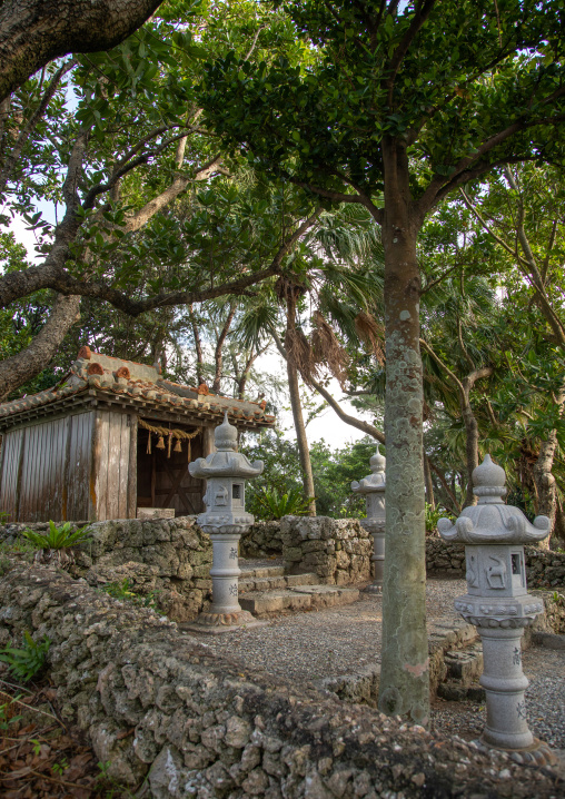 Shrine with stone lanterns in Kabira bay, Yaeyama Islands, Ishigaki-jima, Japan