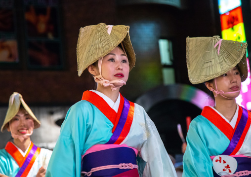 Japanese women with straw hats during the Koenji Awaodori dance summer street festival, Kanto region, Tokyo, Japan