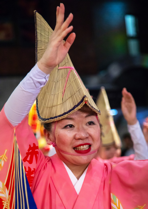 Japanese woman with straw hat during the Koenji Awaodori dance summer street festival, Kanto region, Tokyo, Japan