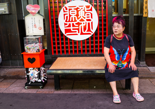 Japanese woman suffering from the heat in omicho market, Ishikawa Prefecture, Kanazawa, Japan