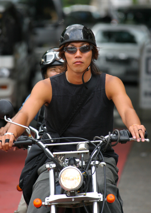 Japanese man riding motorcycle, Kanto region, Tokyo, Japan