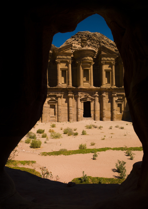 Temple Of Al Deir The Monastery View Through The Window Of A Traditional Family Cave In Petra, Jordan