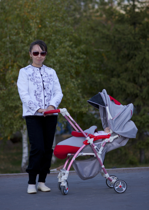 Mother With Her Baby In A Pram, Astana, Kazakhstan