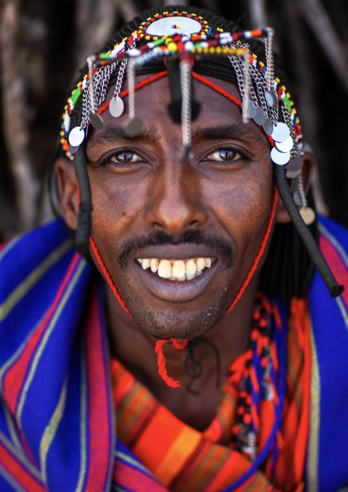 Portrait of a Maasai tribe man with a beaded headwear, Rift Valley Province, Maasai Mara, Kenya