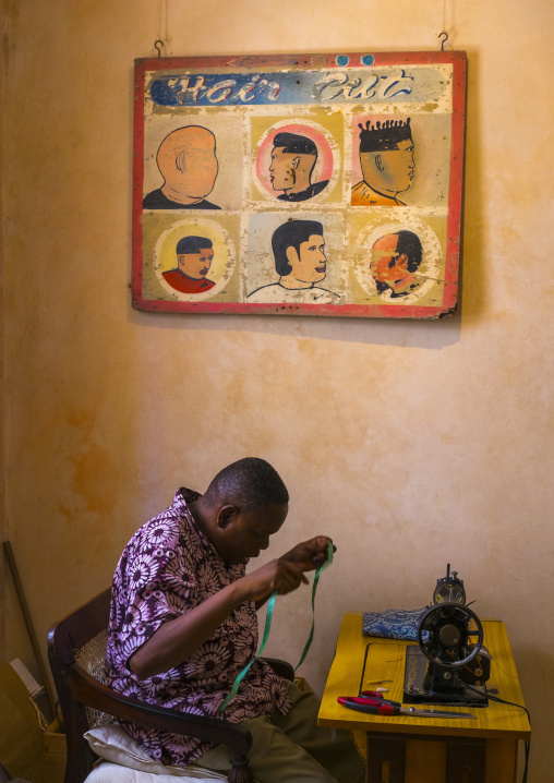 Taylor in a shop, Lamu county, Shela, Kenya