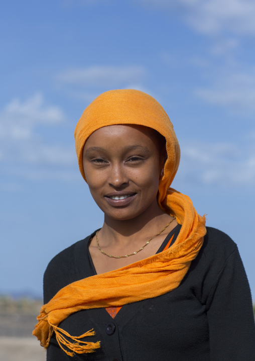 Kenyan woman with an orange scarf, Turkana lake, Loiyangalani, Kenya