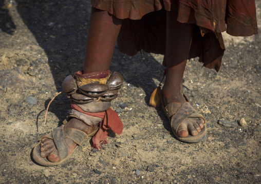 Turkana tribe woman in traditional footwear 'firestone' sandals, Turkana lake, Loiyangalani, Kenya