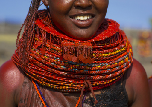 Turkana tribe woman with huge necklaces and ear rings, Turkana lake, Loiyangalani, Kenya