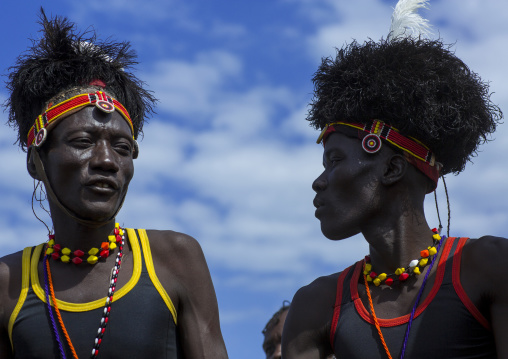 Turkana tribesmen with headwears made of ostrich blackfeathers, Turkana lake, Loiyangalani, Kenya