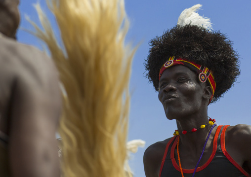 Turkana tribesman with headwear made of ostrich black feathers, Turkana lake, Loiyangalani, Kenya