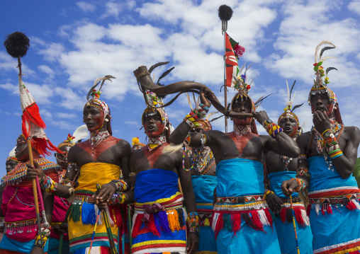 Rendille tribesmen blowing in a horn, Turkana lake, Loiyangalani, Kenya