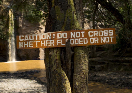 A sign tells the public about flooded river, Nakuru district of the rift valley province, Nakuru, Kenya