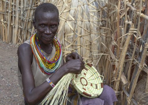 El molo tribeswoman making a basket, Turkana lake, Loiyangalani, Kenya