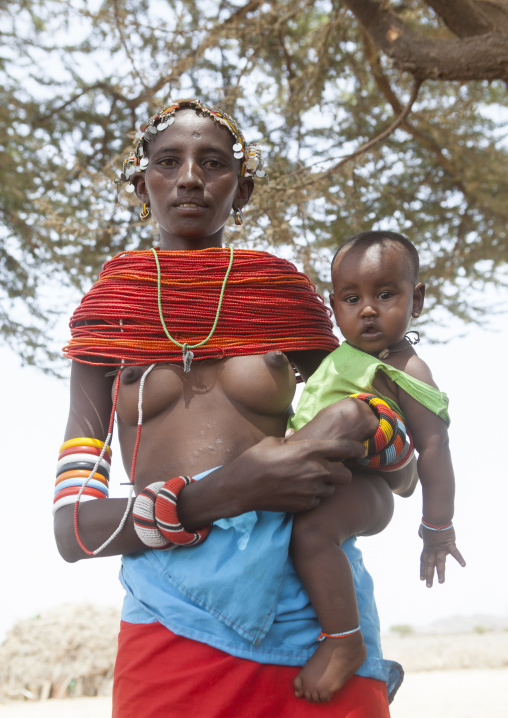 Rendille tribeswoman holding her baby, Marsabit district, Ngurunit, Kenya