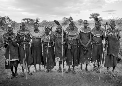 Group of pokot women wearing large necklaces made from the stems of sedge grass, Baringo county, Baringo, Kenya