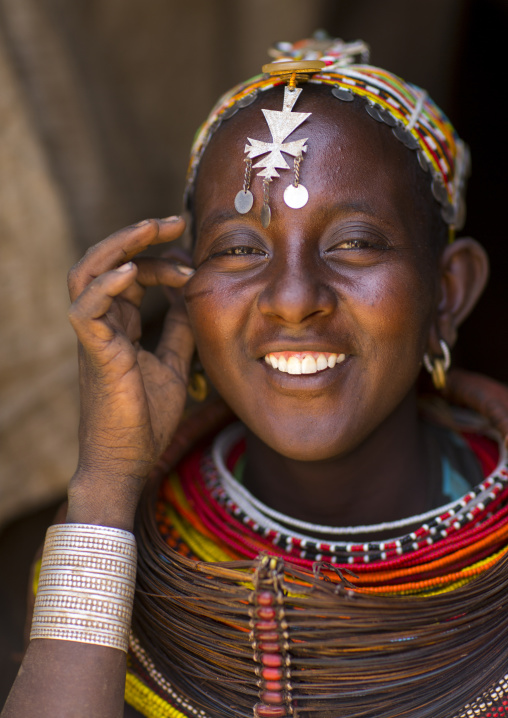 Rendille tribeswoman wearing traditional headdress and mpooro engorio necklace, Marsabit district, Ngurunit, Kenya