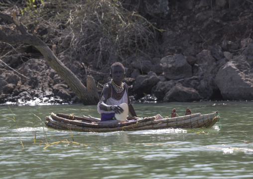 Old woman on a traditional boat rowing, Baringo county, Baringo, Kenya