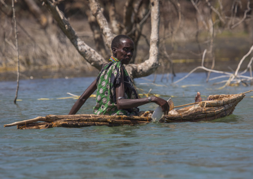 Old woman on a traditional boat rowing, Baringo county, Baringo, Kenya