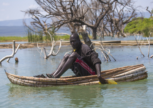 Fisherman in traditional boat rowing
, Baringo county, Baringo, Kenya