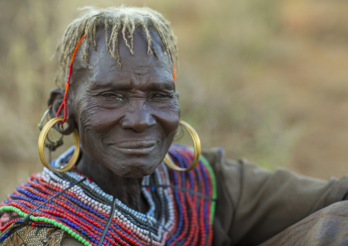 A pokot woman wears large necklaces made from the stems of sedge grass, Baringo county, Baringo, Kenya