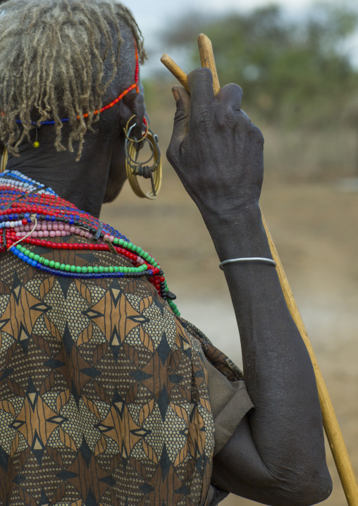 A pokot woman wears large necklaces made from the stems of sedge grass, Baringo county, Baringo, Kenya