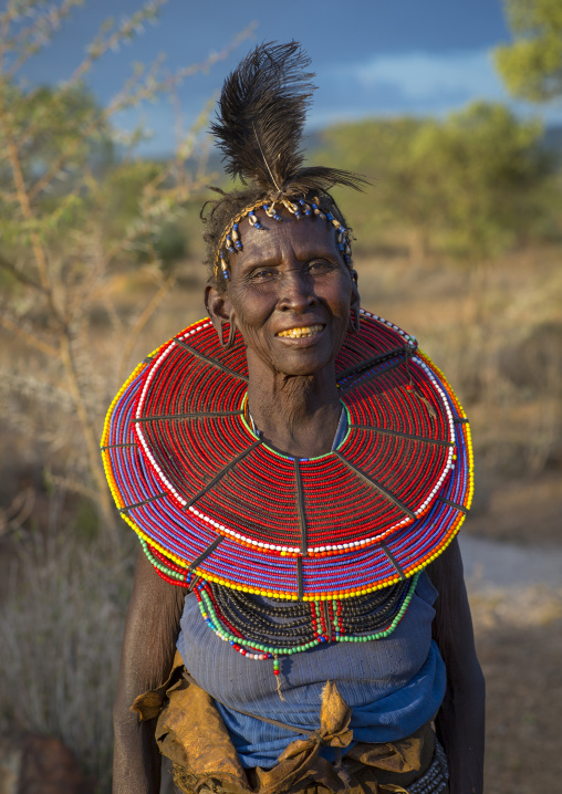 A pokot woman wears large necklaces made from the stems of sedge grass, Baringo county, Baringo, Kenya