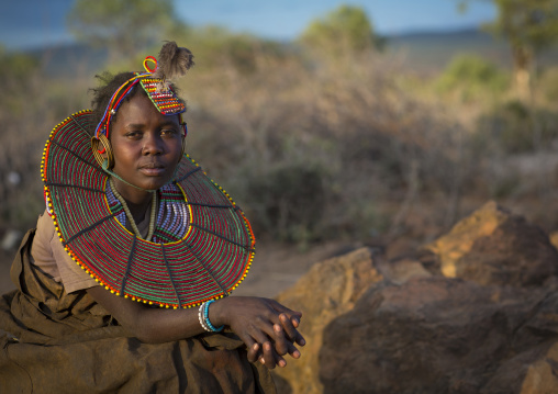 A pokot girl wears large necklaces made from the stems of sedge grass, Baringo county, Baringo, Kenya