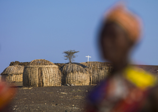 Grass huts and christian cross in el molo tribe village, Turkana lake, Loiyangalani, Kenya