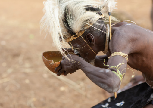 Tharaka tribe man drinking in a calabash, Laikipia County, Mount Kenya, Kenya