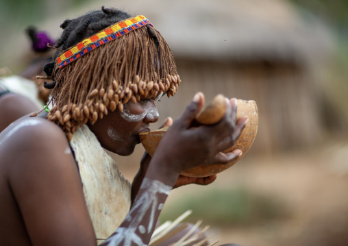 Tharaka tribe woman drinking alcohol in a calabash, Laikipia County, Mount Kenya, Kenya