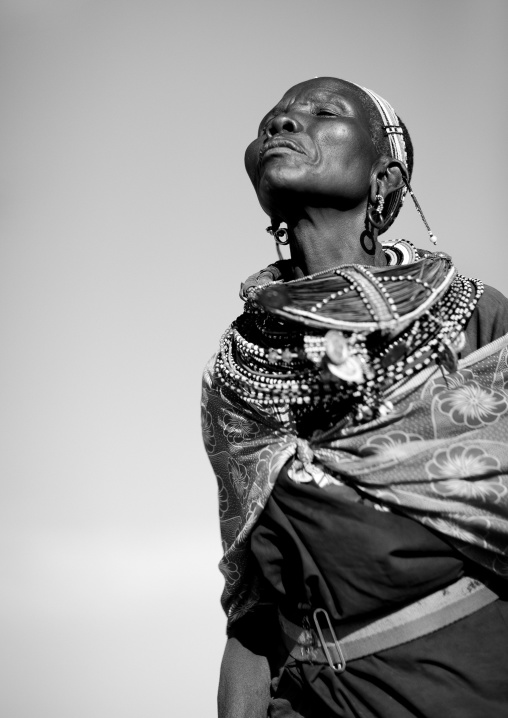 Samburu woman dancing with traditional jewellry, Samburu county, Samburu national reserve, Kenya