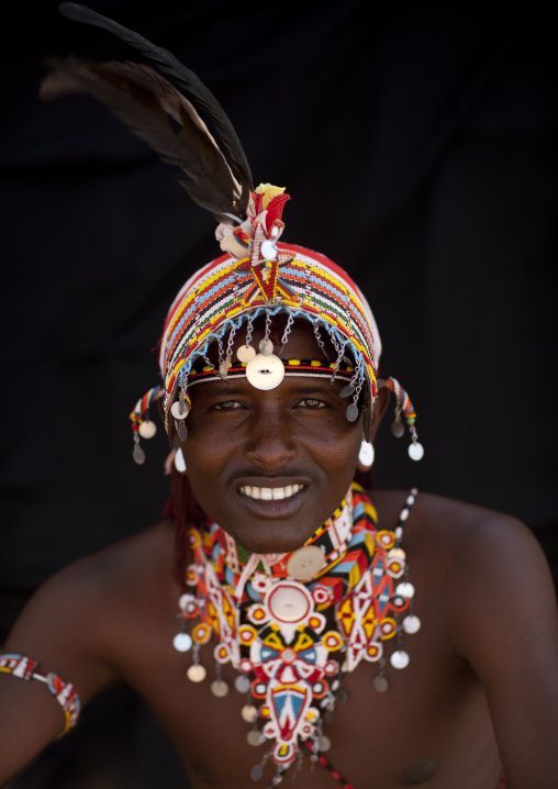 Portrait of a smiling Samburu tribe warrior with beaded headwear, Samburu County, Maralal, Kenya