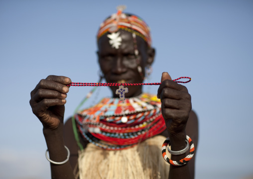 Portrait of an El Molo tribe woman showing a christian cross, Rift Valley Province, Turkana lake, Kenya