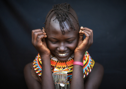 Smiling Turkana tribe woman with necklaces and earrings, Rift Valley Province, Turkana lake, Kenya