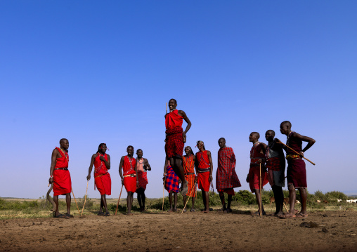 Maasai tribe men jumping during a ceremony, Rift Valley Province, Maasai Mara, Kenya