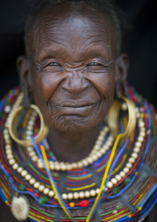 A pokot woman wears large necklaces made from the stems of sedge grass, Baringo county, Baringo, Kenya