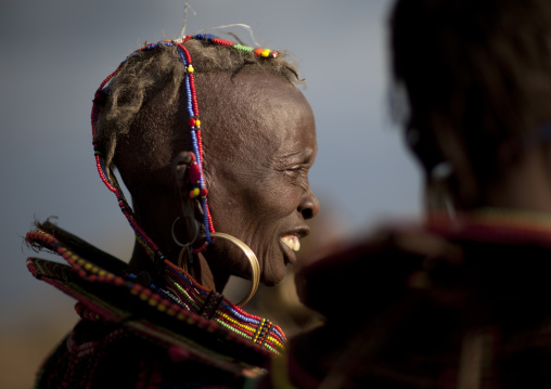 A pokot woman wears large necklaces made from the stems of sedge grass, Baringo county, Baringo, Kenya