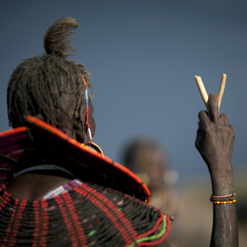 A pokot woman wears large necklaces made from the stems of sedge grass, Baringo county, Baringo, Kenya